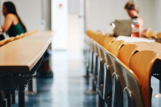 Bright classroom scene with wooden chairs, ideal for educational themes.