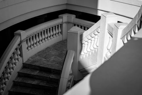 Grayscale Photo of Concrete Staircase