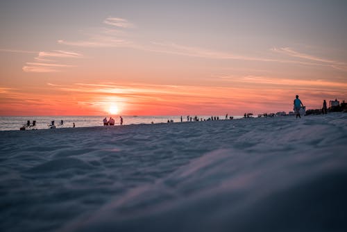 People on Beach during Sunset