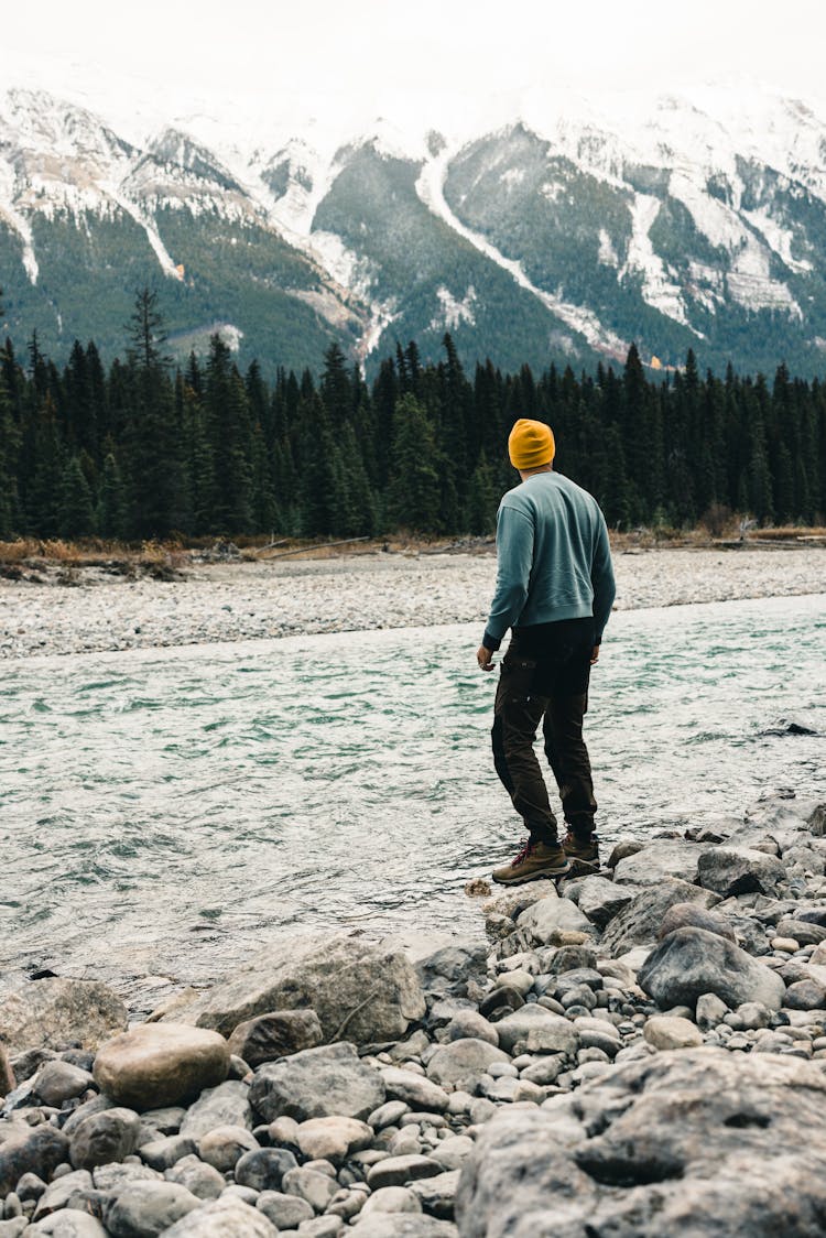 Man Near A River In Kootenay National Park In Canada