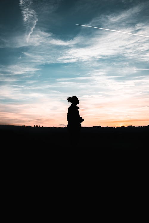 Silhouette of a Woman during Sunset