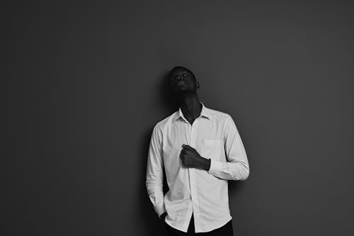 Man in White Long Sleeves Looking Up