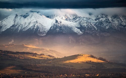 Snow Covered Mountain during Sunset