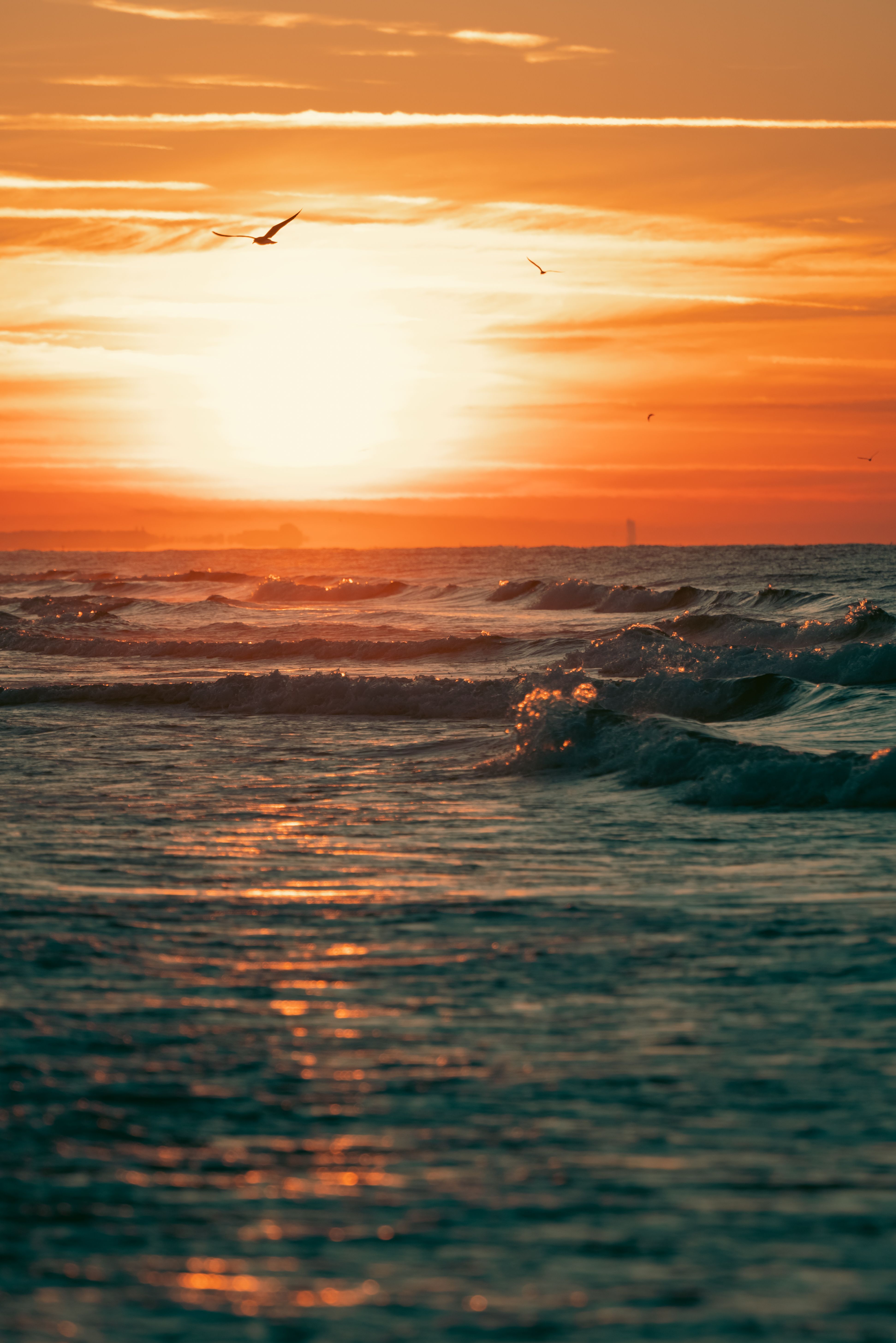 Sunset over the sea horizon