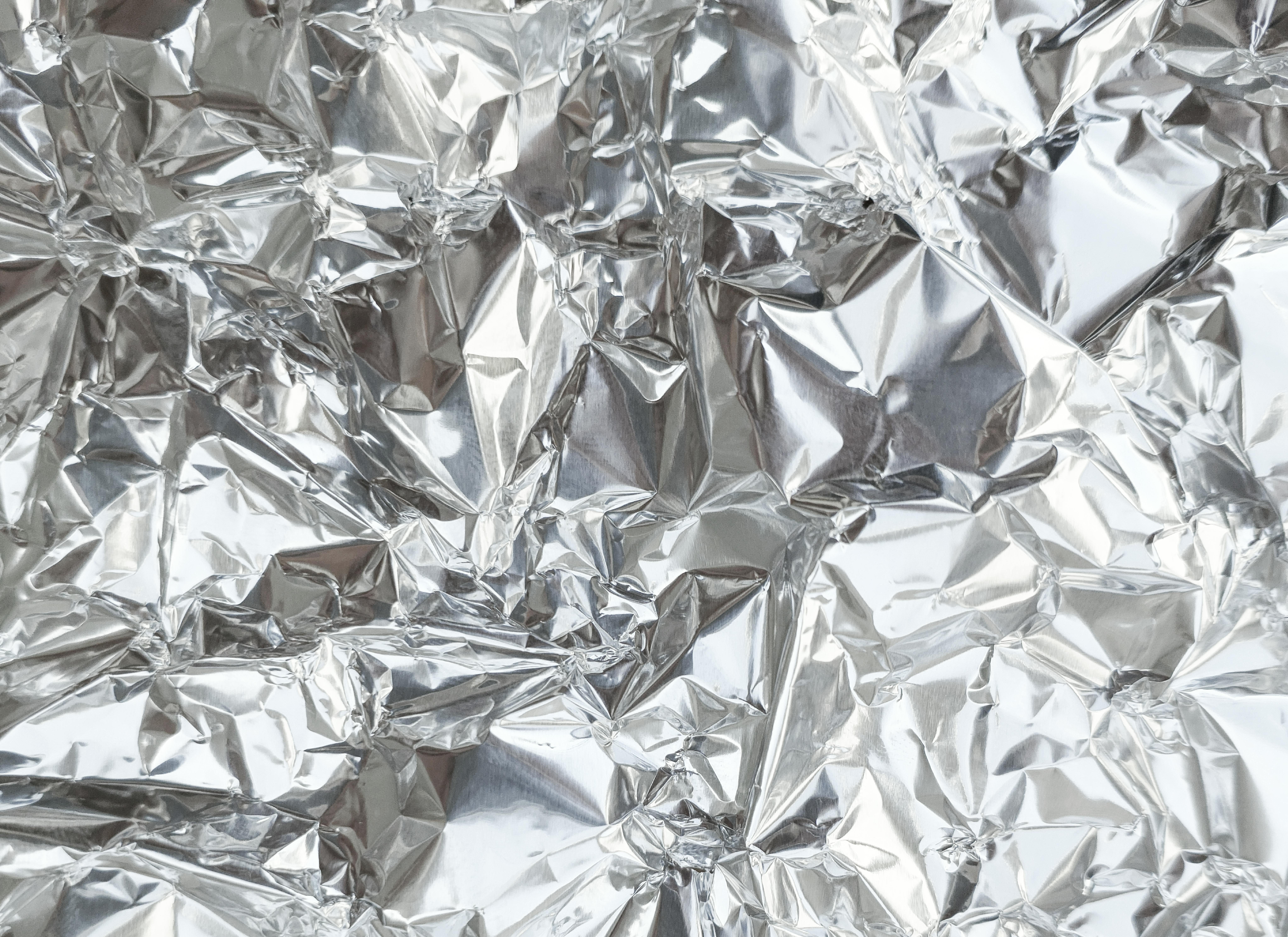 Detailed Close Up Texture Of An Aluminum Foil Surface In Different