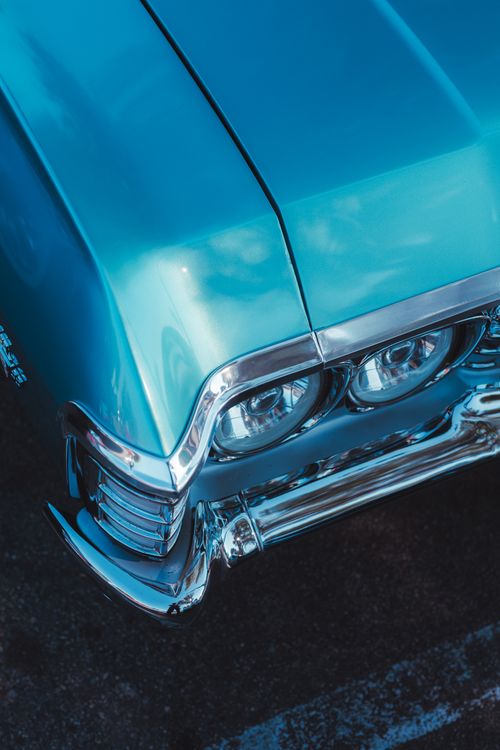 Free Detailed view of a vintage car's hood and headlights, showcasing its classic design. Stock Photo
