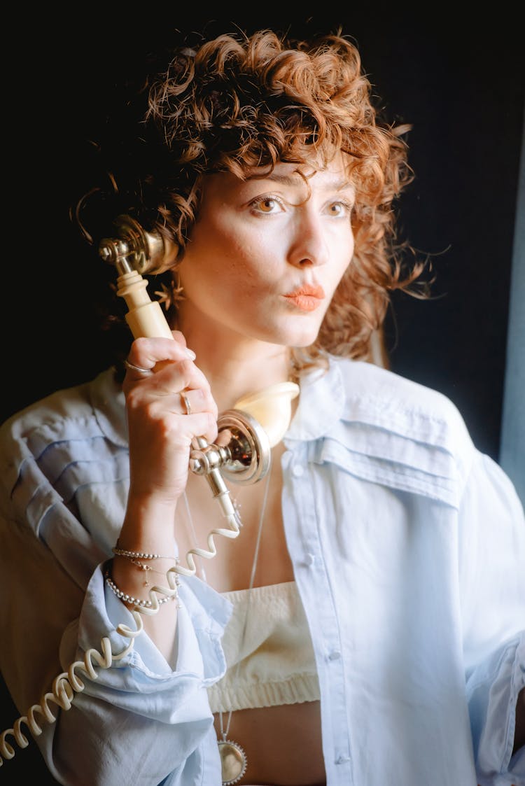 Woman Posing With Telephone