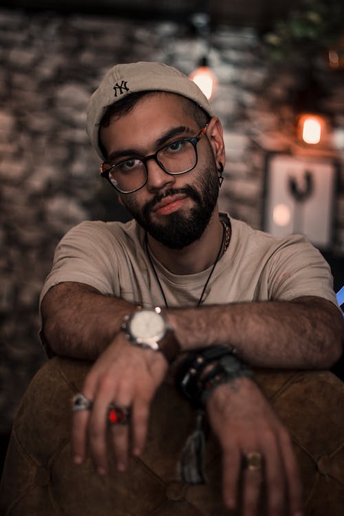 Photo of a Young Bearded Man Wearing Eyeglasses