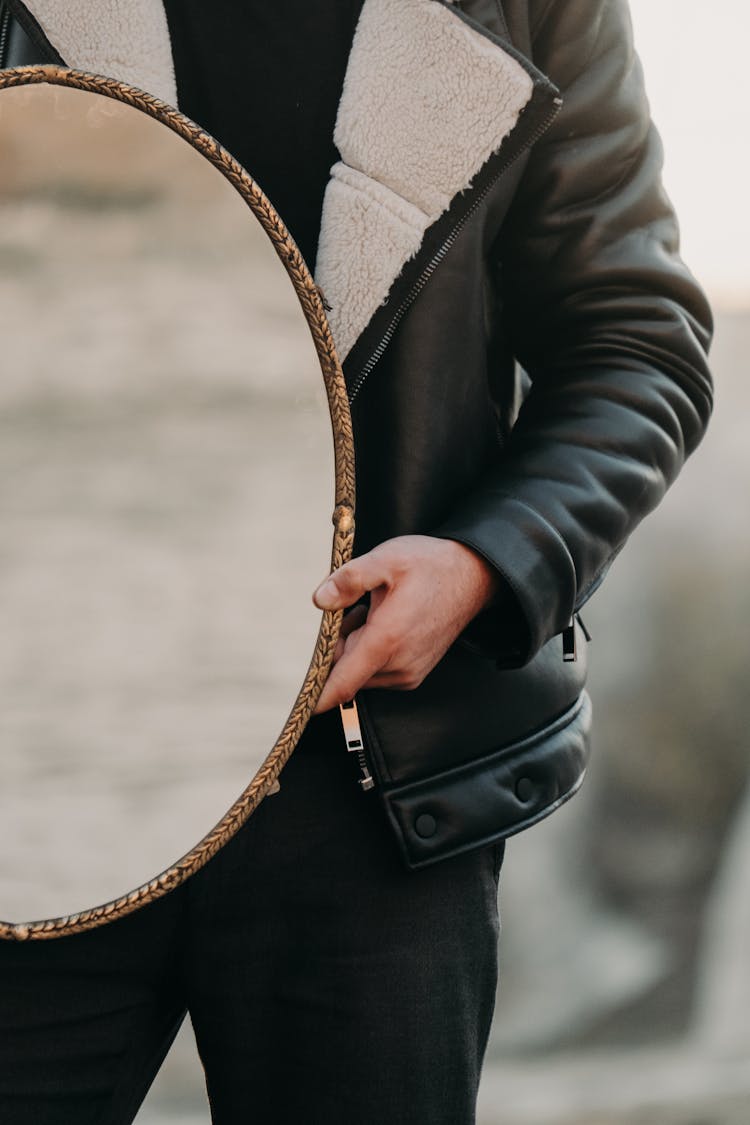 Man Holding Mirror