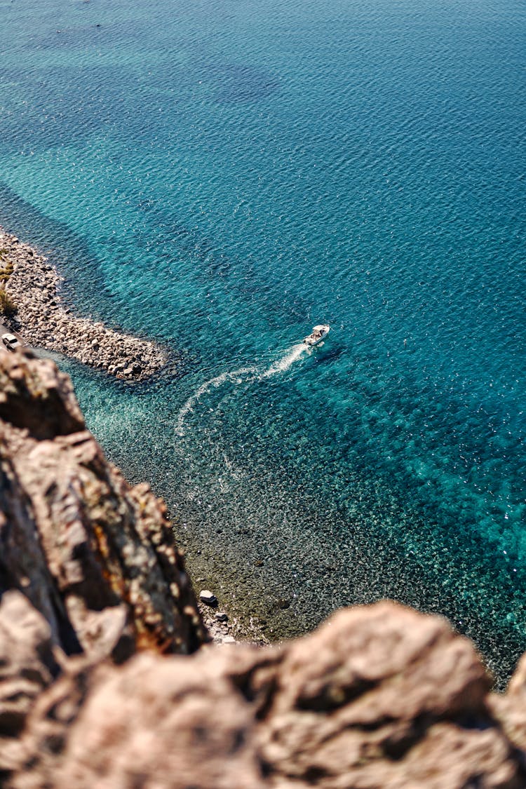 Boat Sailing On Turquoise Sea