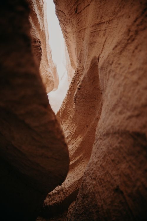 Free Explore the mesmerizing curves and textures of sandstone rock formations within a canyon. Stock Photo