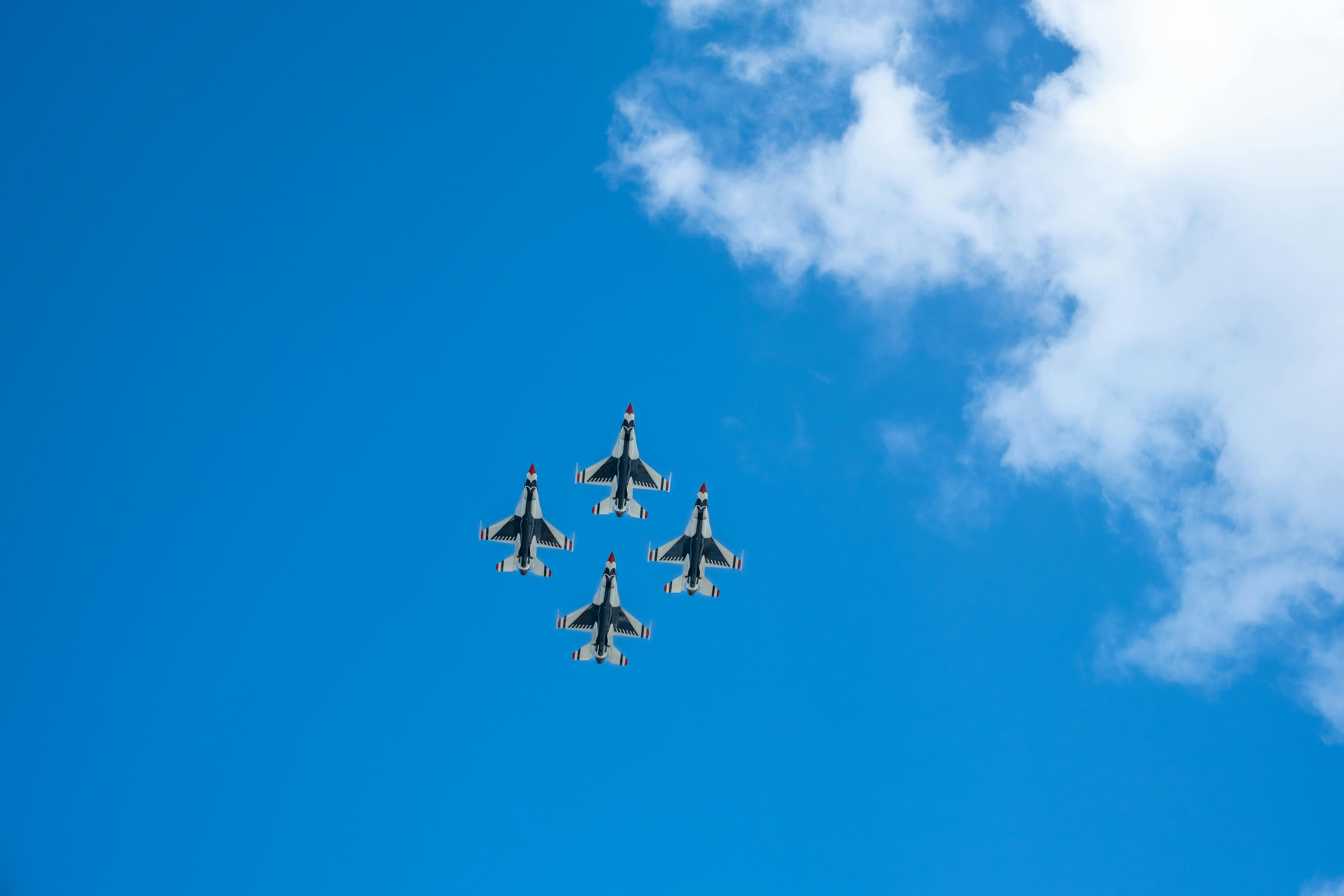 Four Fighter Planes in Mid Air Under Blue Sky · Free Stock Photo