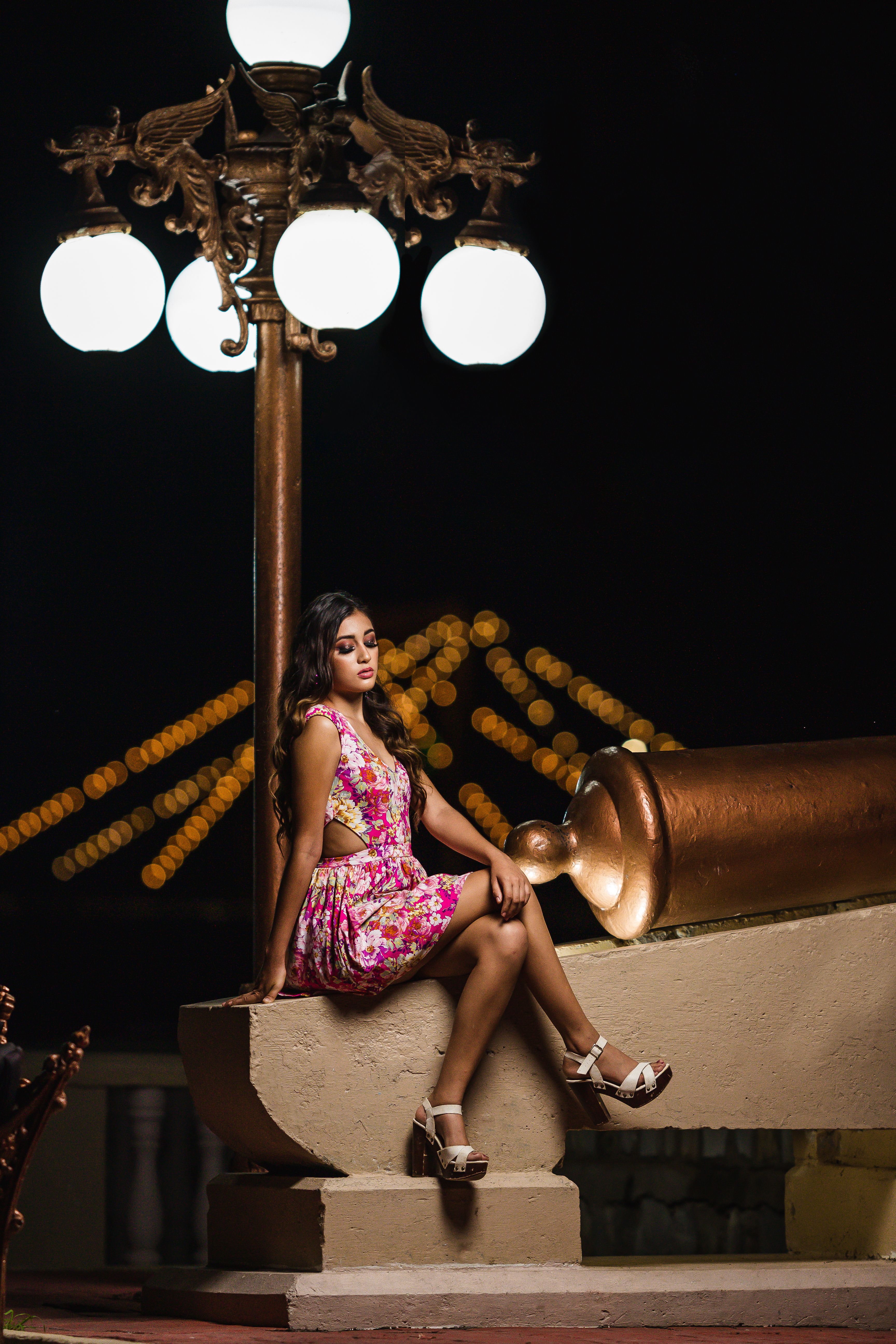 Woman in Pink Dress Sitting on Concrete · Free Stock Photo