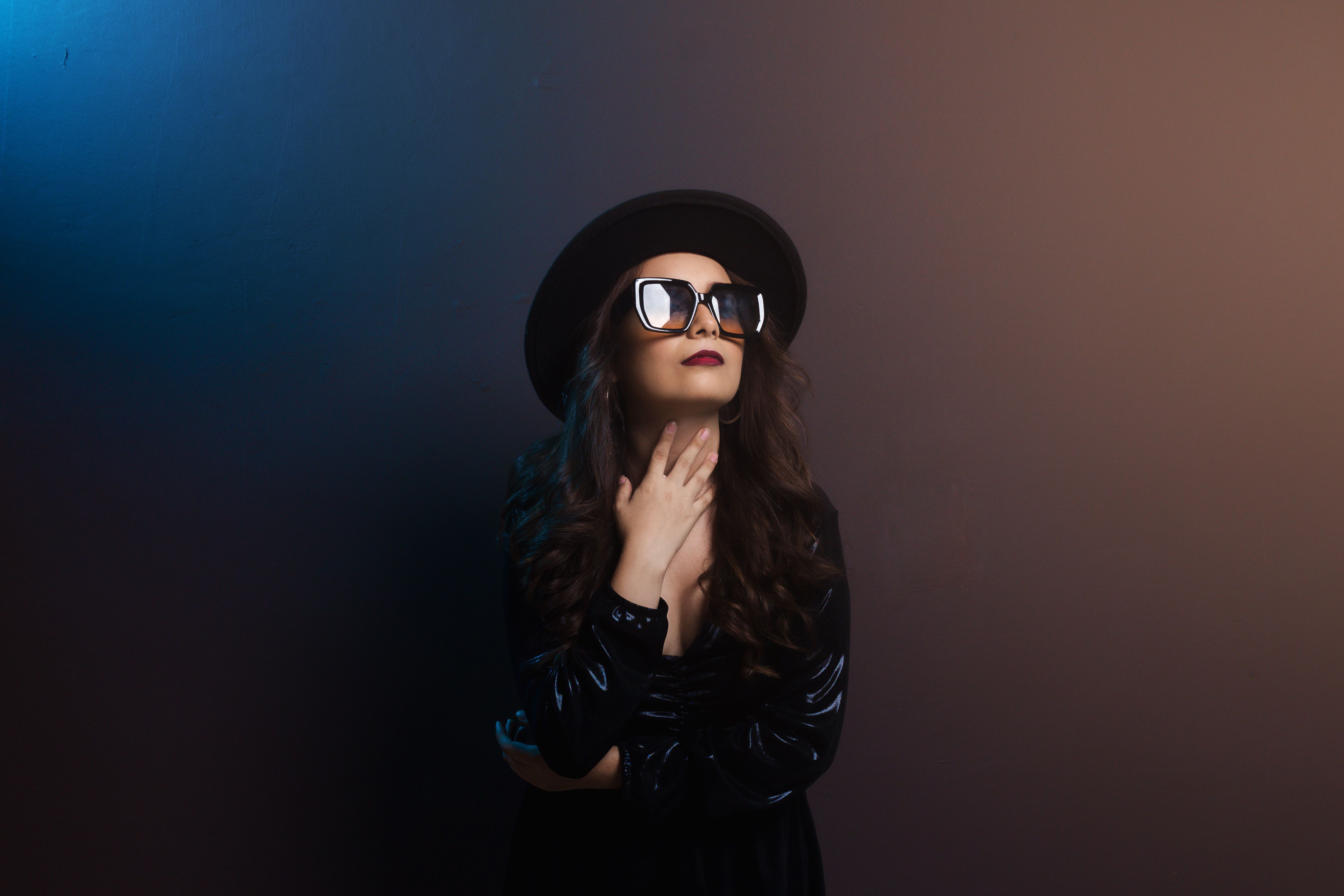 Woman in Black Leather Jacket Wearing Black Sunglasses and a Black Hat ...
