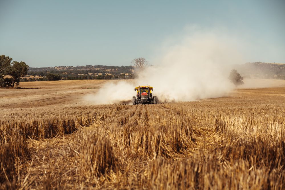 Well-kept machine working a field at golden hour