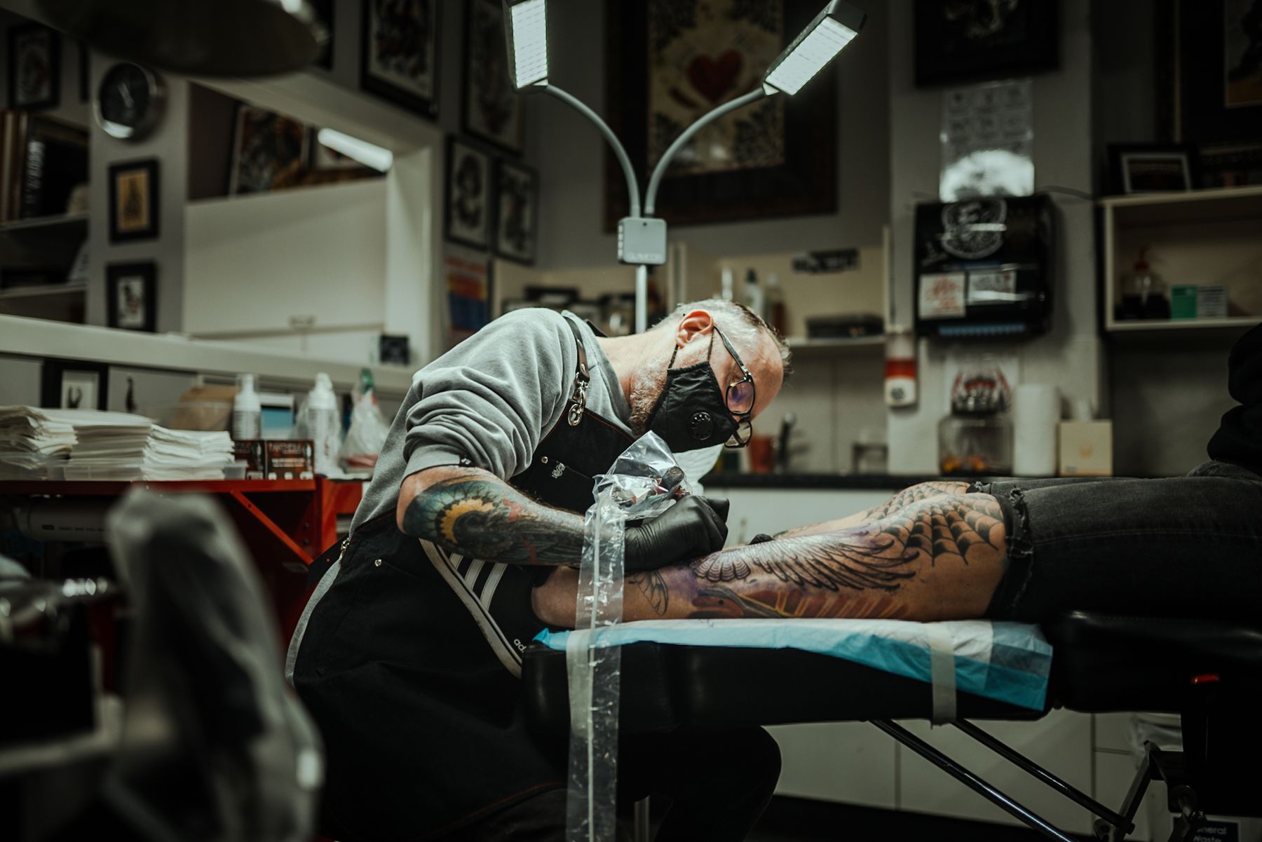 Tattoo work on a client's leg