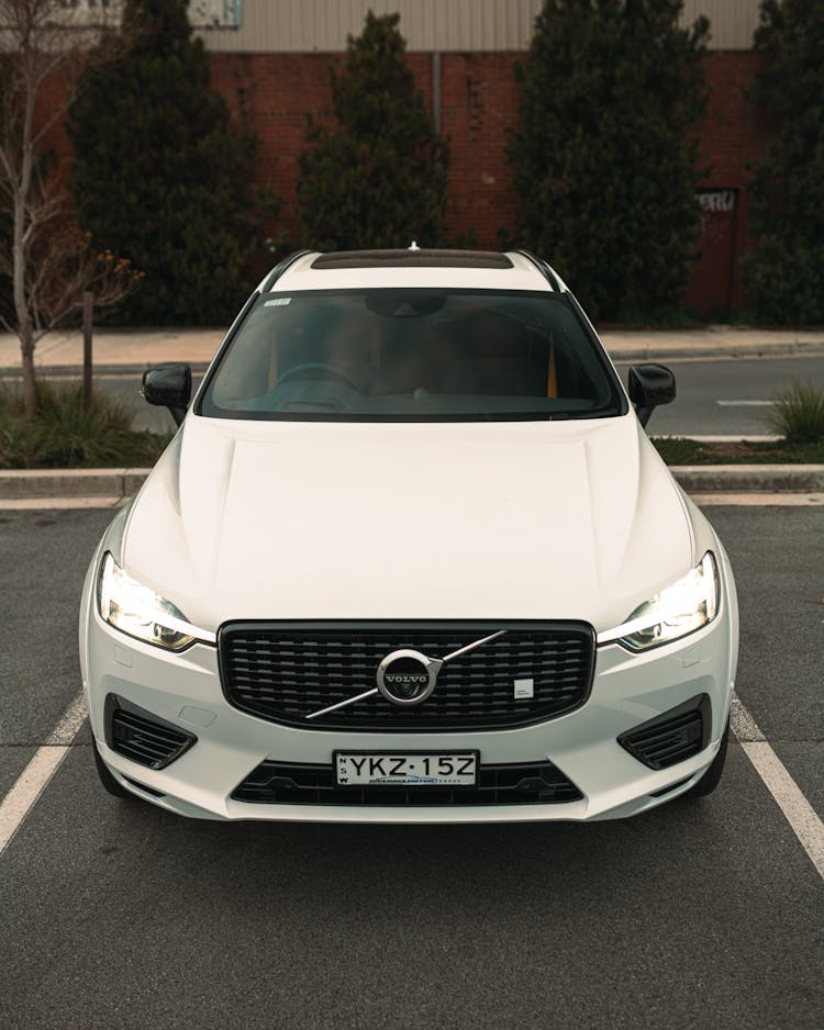 A White Volvo Car Parked On The Street