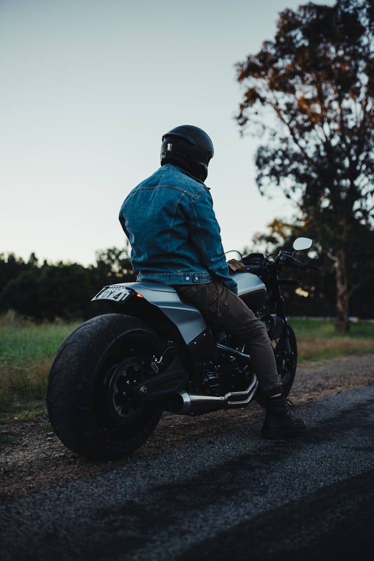 Man On A Motorcycle At Dusk 