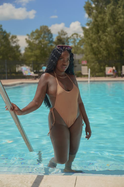 Woman in Brown Swimsuit Standing on the Poolside