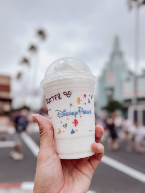 Free Person Holding a Drink in a Plastic Cup Stock Photo