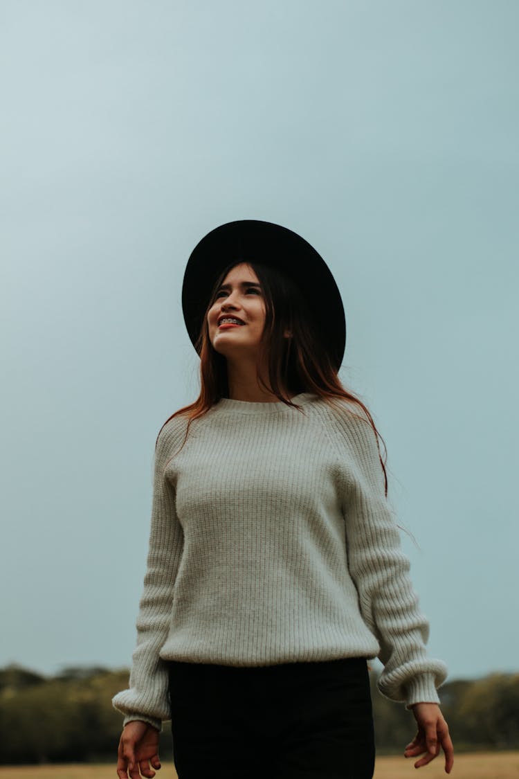 Woman In Hat Looking Up