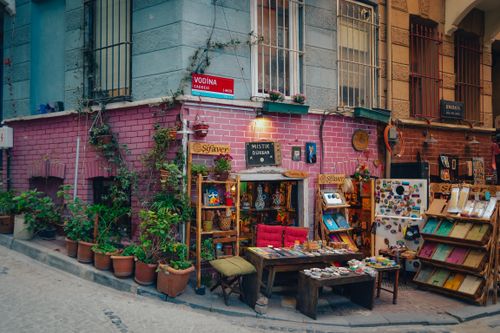Free Vibrant street corner in Istanbul showcasing a quaint store with colorful merchandise and potted plants. Stock Photo