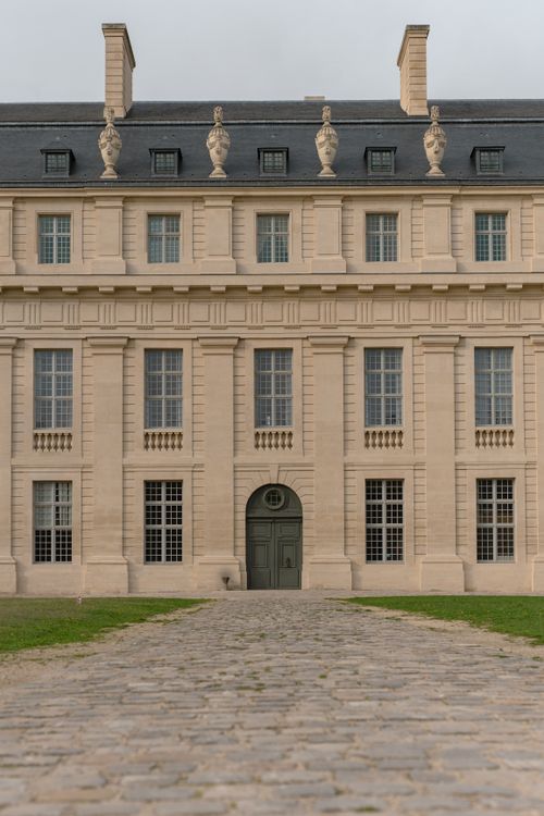 Free Explore the timeless elegance of the Château de Vincennes facade in this serene, architectural capture. Stock Photo