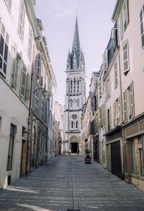Free Picturesque street leading to St Martin's Church in Pau, France, showcasing classic European architecture. Stock Photo