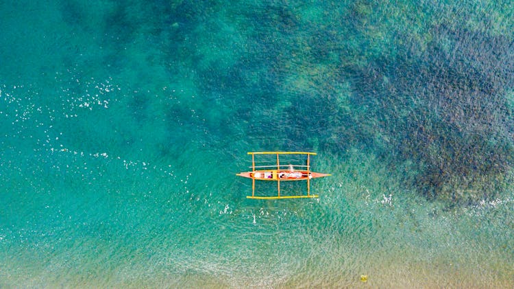 Wooden Boat On Body Of Water