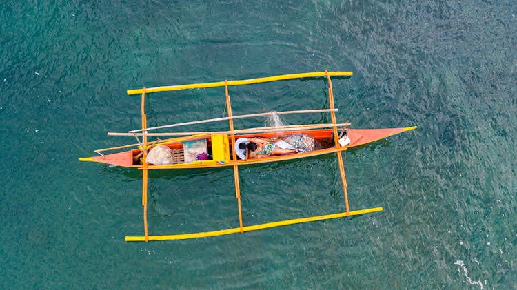 Couple On A Wooden Boat