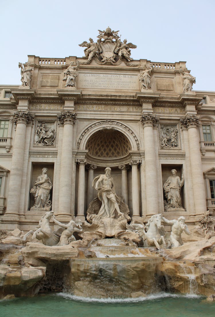 White Concrete Building With Statues