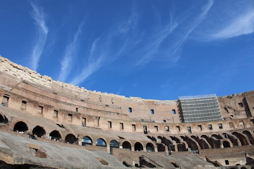 Free Upper Tier of the Colosseum in Rome, Italy Under Blue Sky Stock Photo