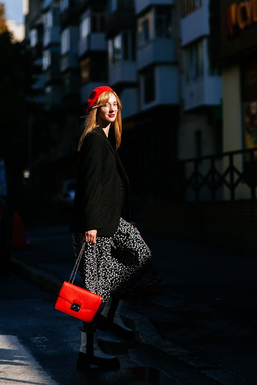 Woman Holding a Red Bag