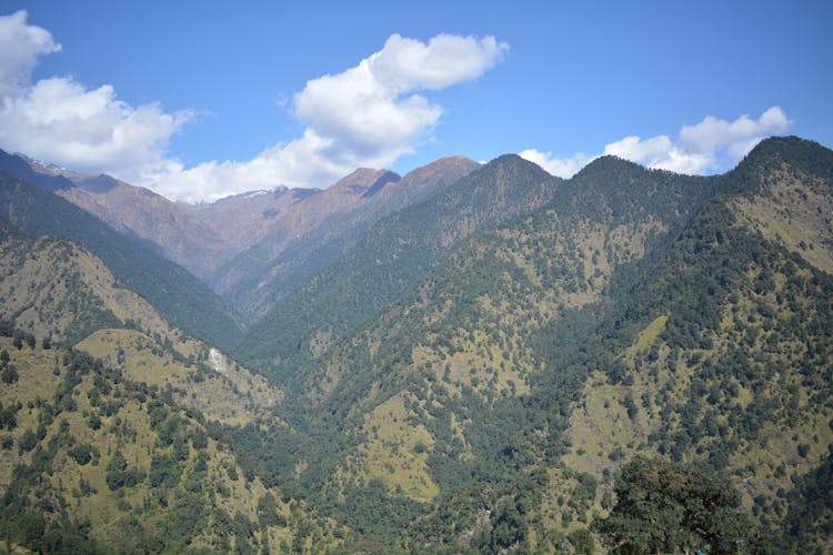 White Clouds And Blue Sky Over Mountains