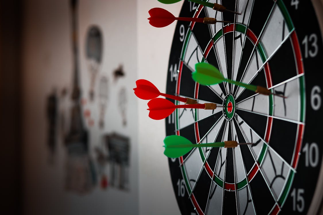 Free Close-Up Photo of Dart Pins on Dartboard Stock Photo