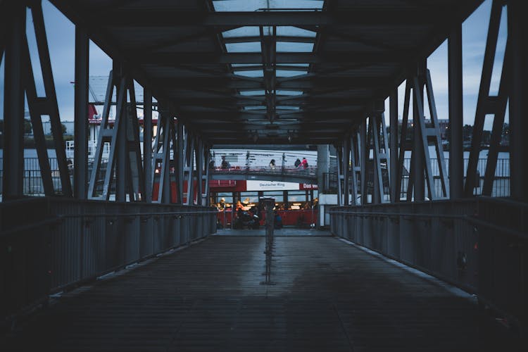 A Steel Bridge Near Red Bus 