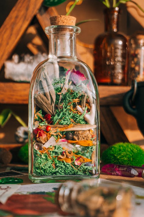 Clear Glass Bottle With Green Dried Leaves