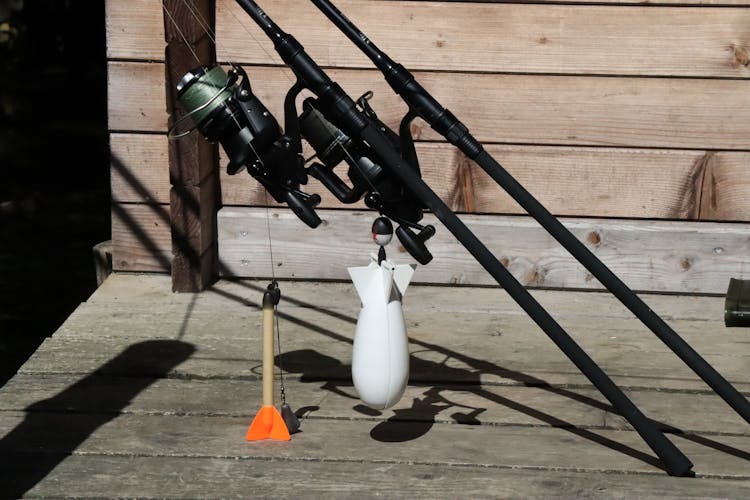 Fishing Rods Beside A Wooden Wall