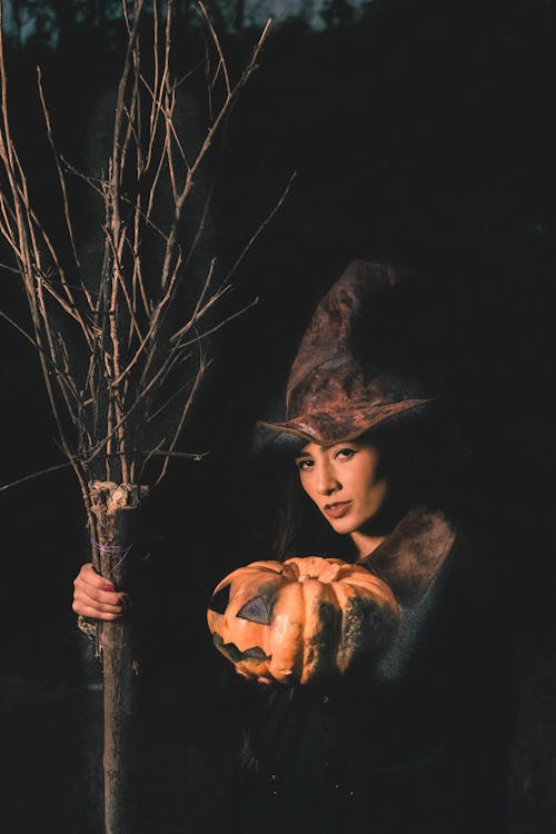 A Woman Holding a Pumpkin