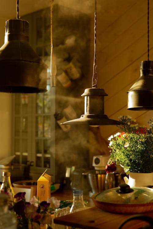 Lamps Hanging Above Wooden Table