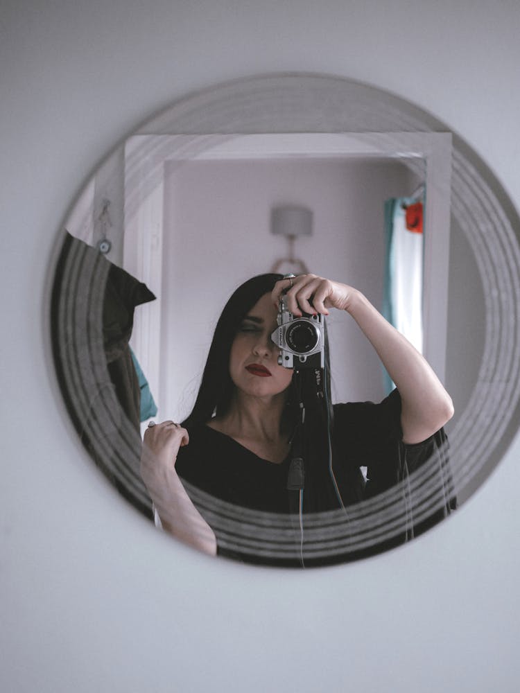 Woman Taking Selfie In Mirror