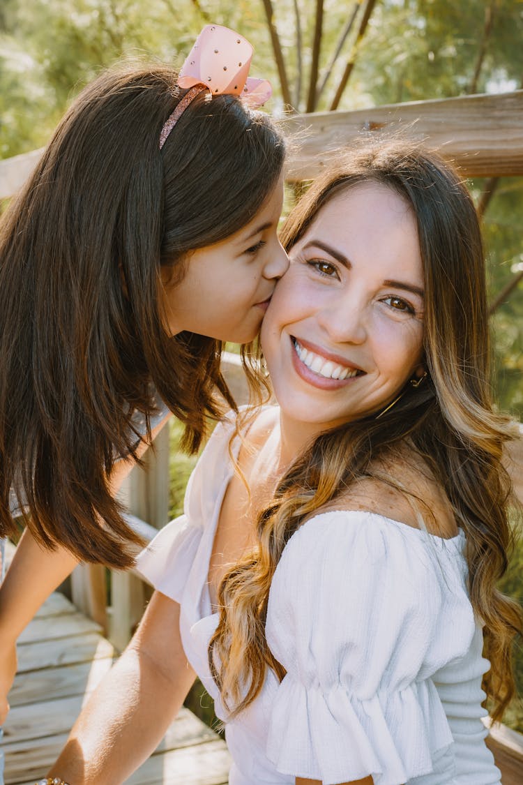 A Daughter Kissing Her Mother 