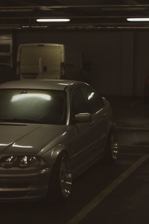 BMW E39 Parked Next to the Construction Site of an Apartment Building ·  Free Stock Photo
