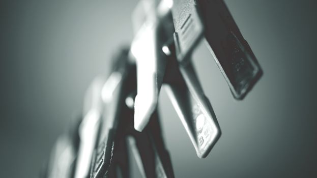 Macro shot of black and white clothespins with a blurred background. Ideal for abstract and minimalist themes.