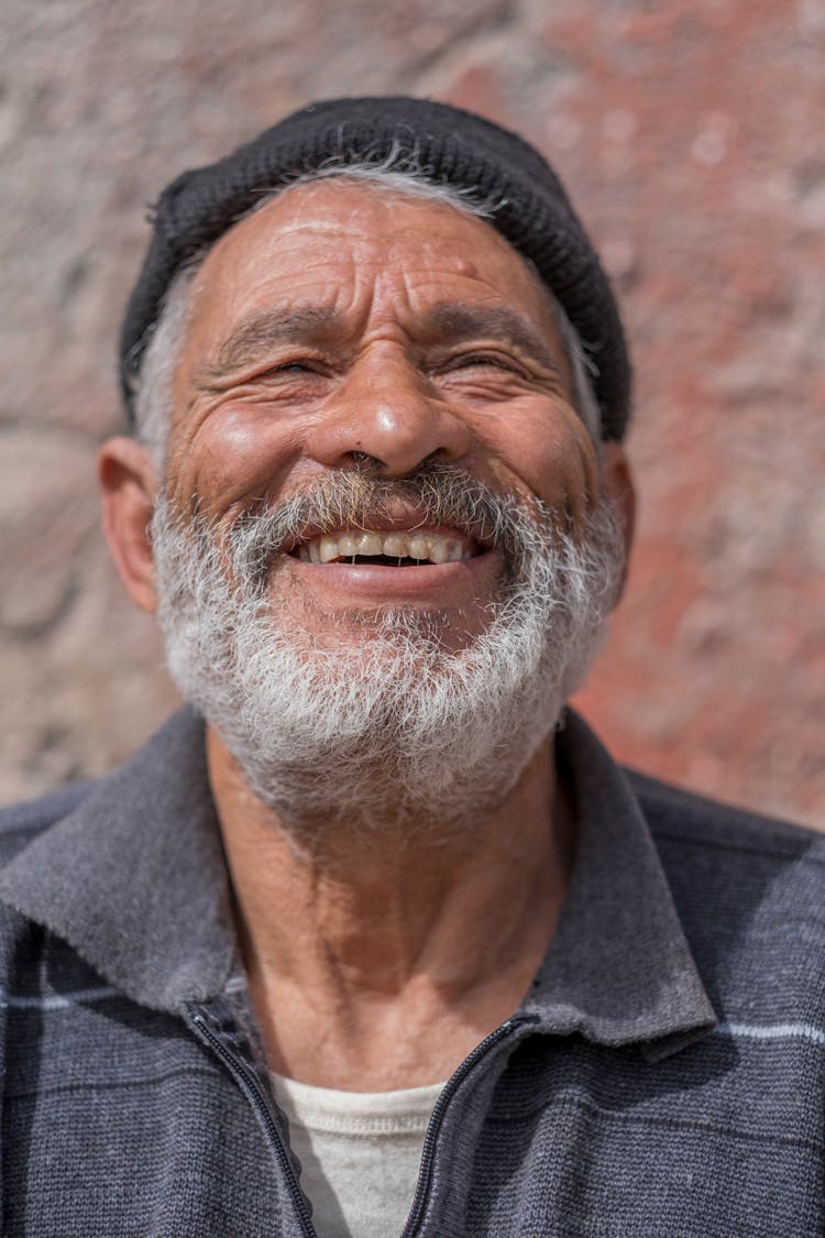 Elderly Man With A Gray Beard Smiling 