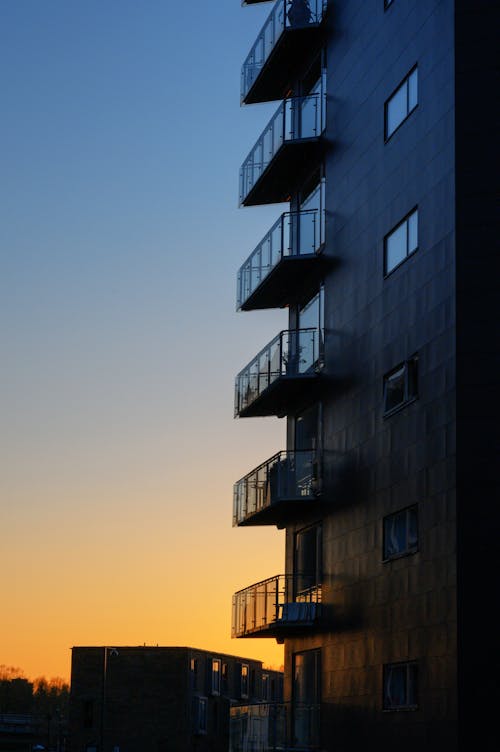 Concrete Building with Glass Railings During Sunset