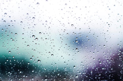 Closeup Photo of Water Dew on Glass