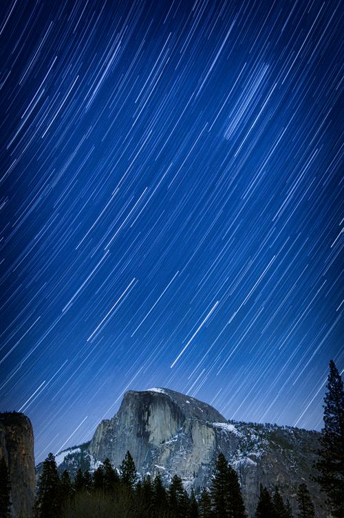Free Stunning long exposure of star trails over Half Dome at night in Yosemite Valley. Stock Photo