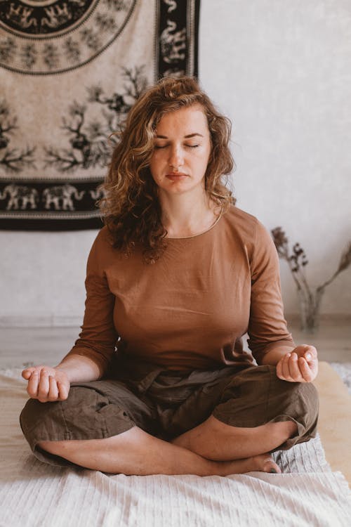 Woman Sitting and Meditating