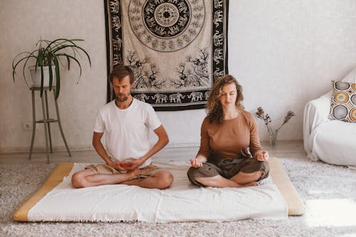 Woman and Man Meditating